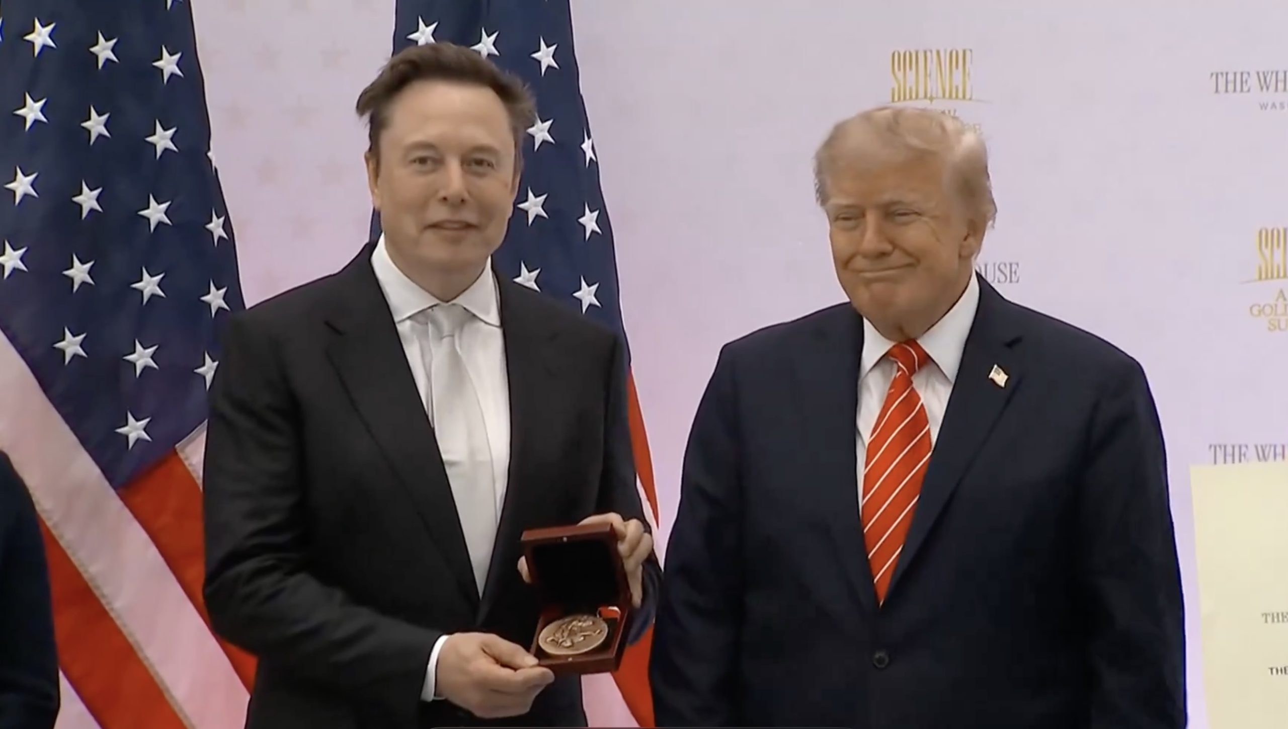 Elon Musk holds the National Medal of Science alongside President Donald Trump at the “Science: A New Golden Age” summit in Washington on October 8, 2026.